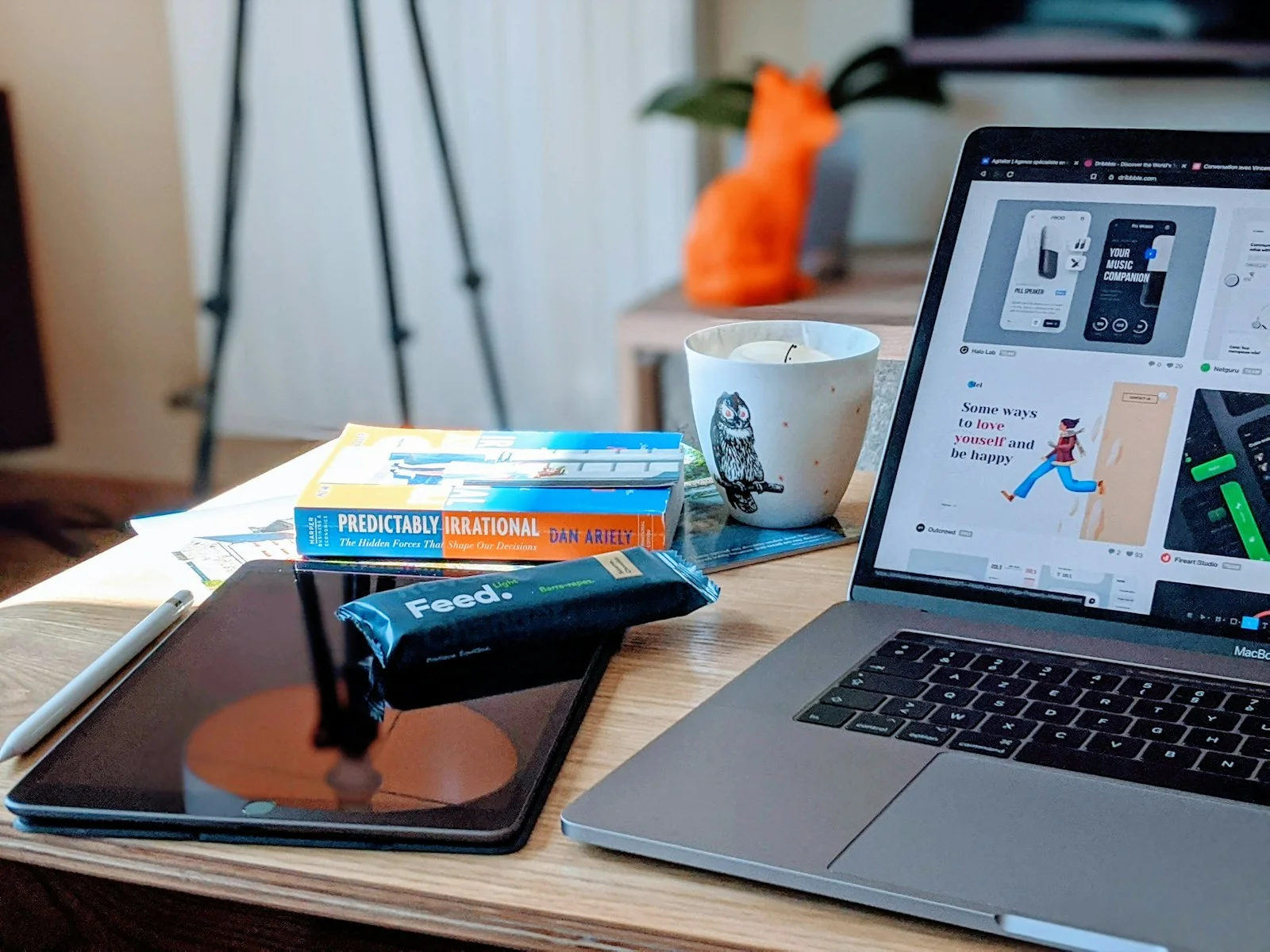 macbook pro beside white ceramic mug on brown wooden table macbook pro beside white ceramic mug on brown wooden table